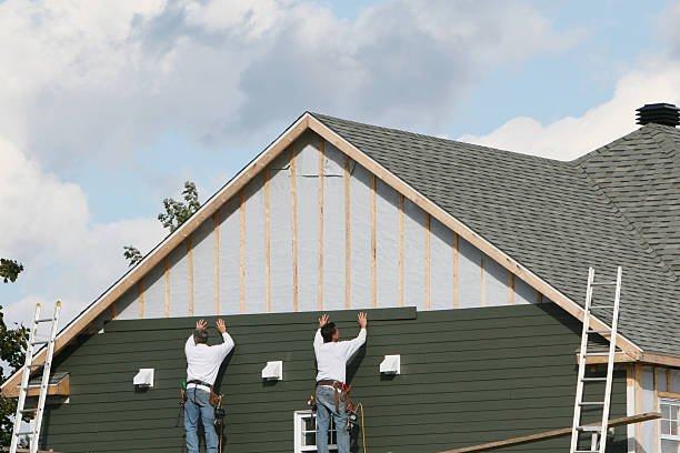 Professional Siding Replacement technician working in Siloam, NC